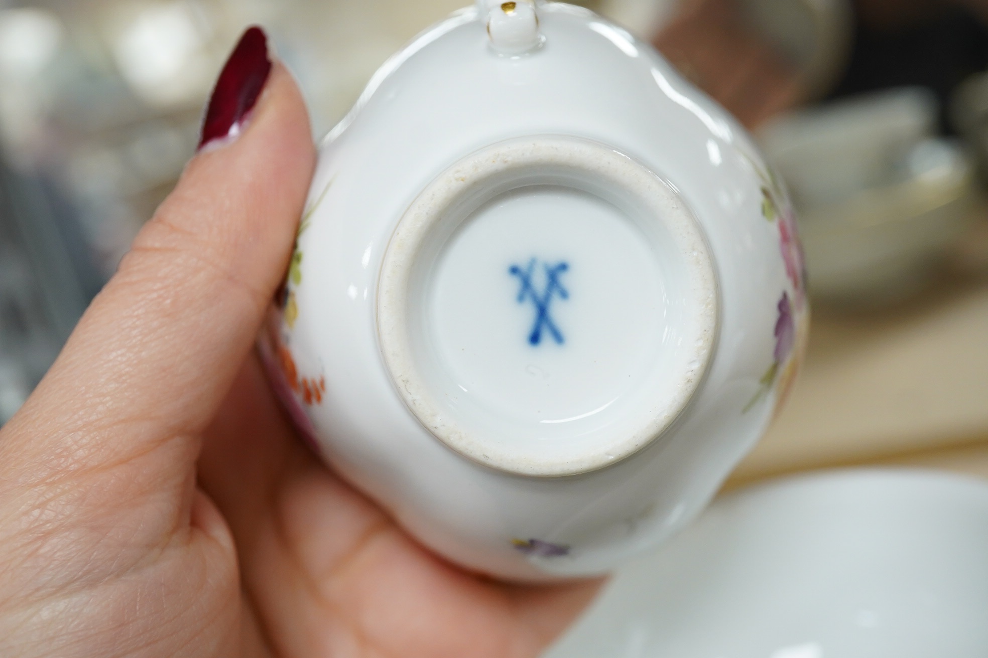 A group of 19th century Meissen porcelain cups and saucers. Condition - one teacup has a re-glued handle